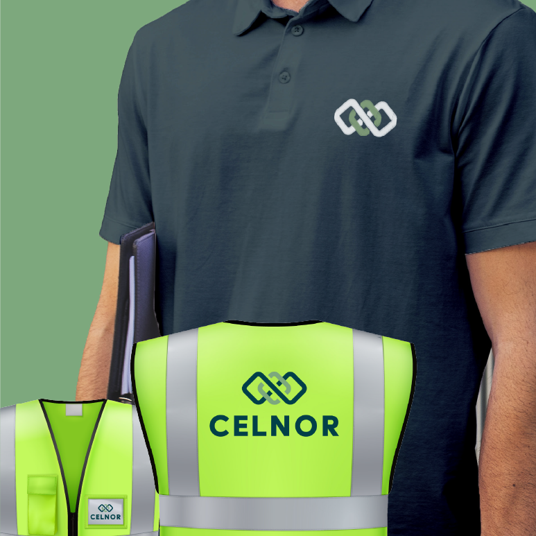 Person wearing a navy blue polo shirt with Celnor logo and two high-visibility vests with Celnor branding