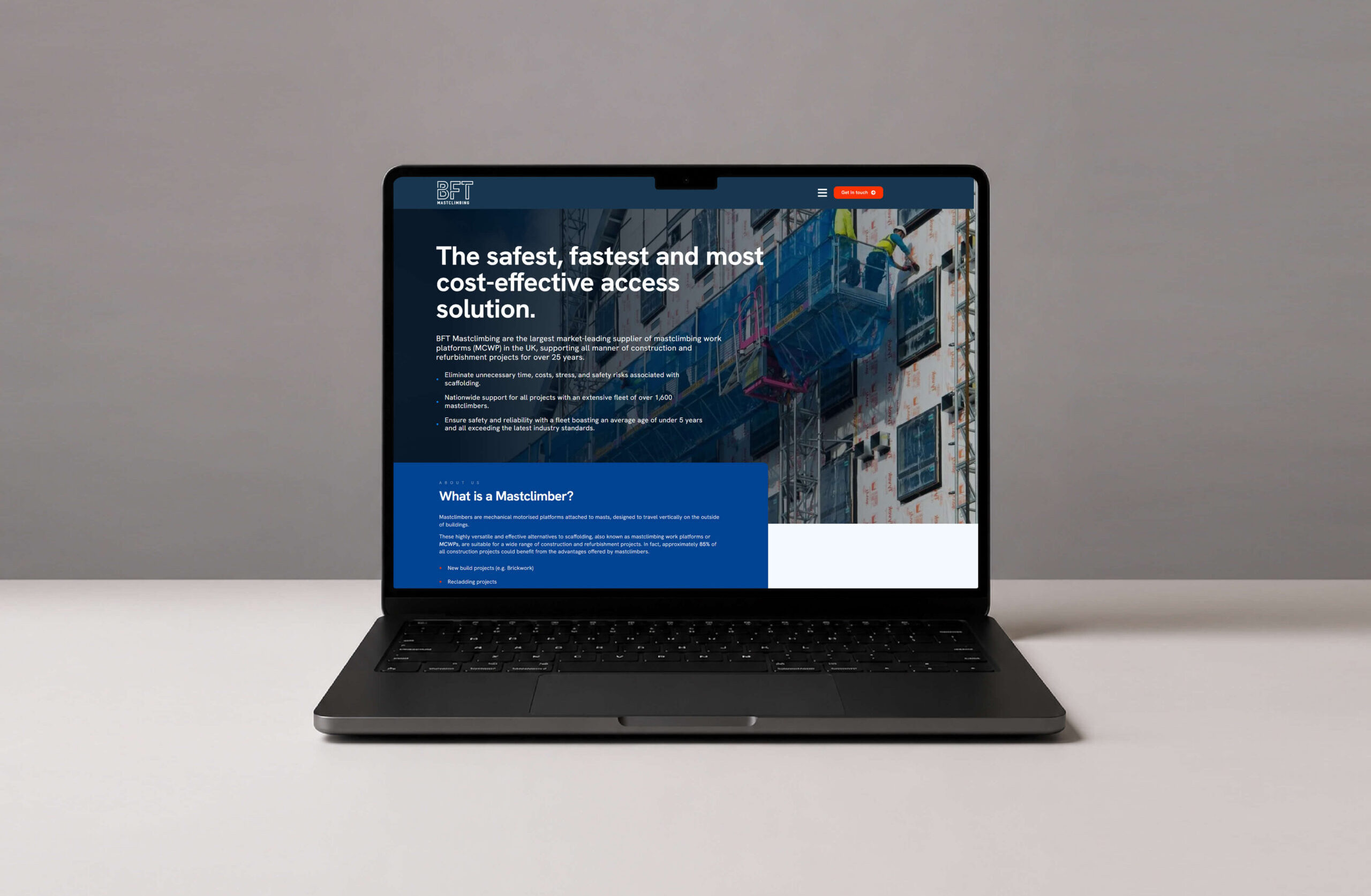 Laptop displaying BFT Mastclimbing website with construction access solutions