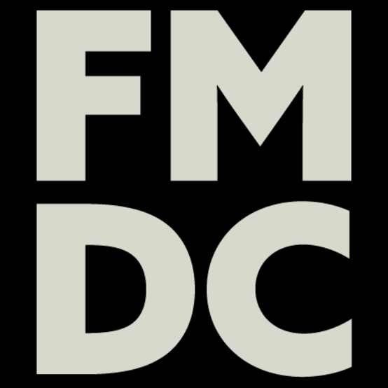 Logo with the letters FMDC in bold light gray on a black background