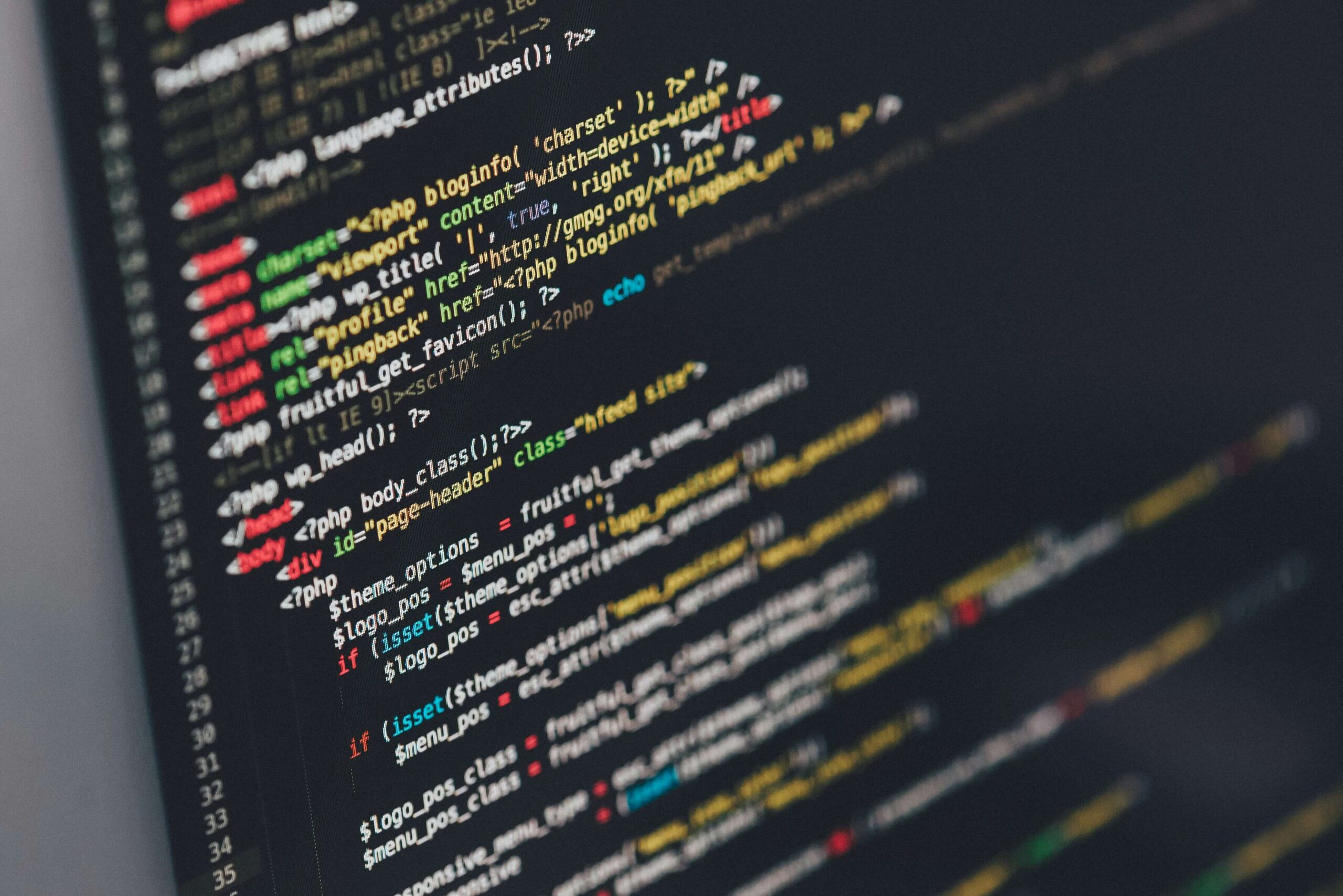 Close-up of computer screen displaying website source code