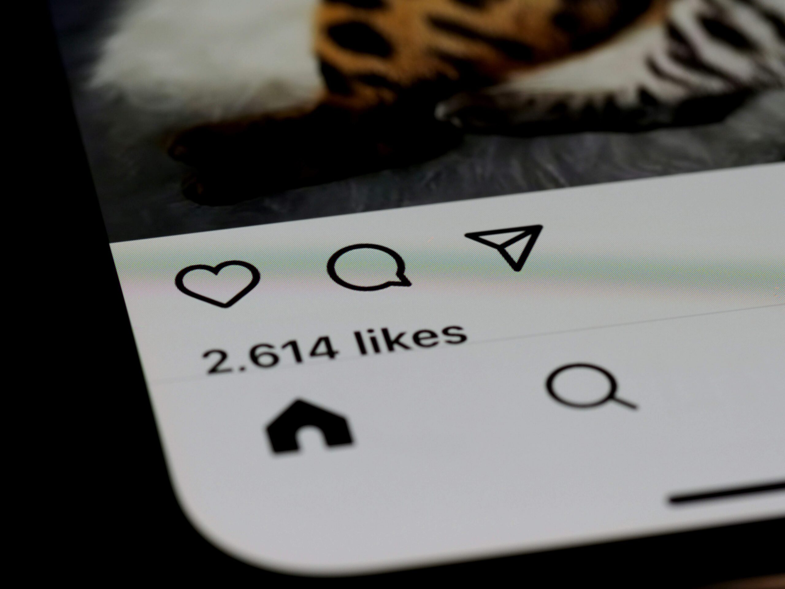 Close-up of social media interface showing likes and interaction icons