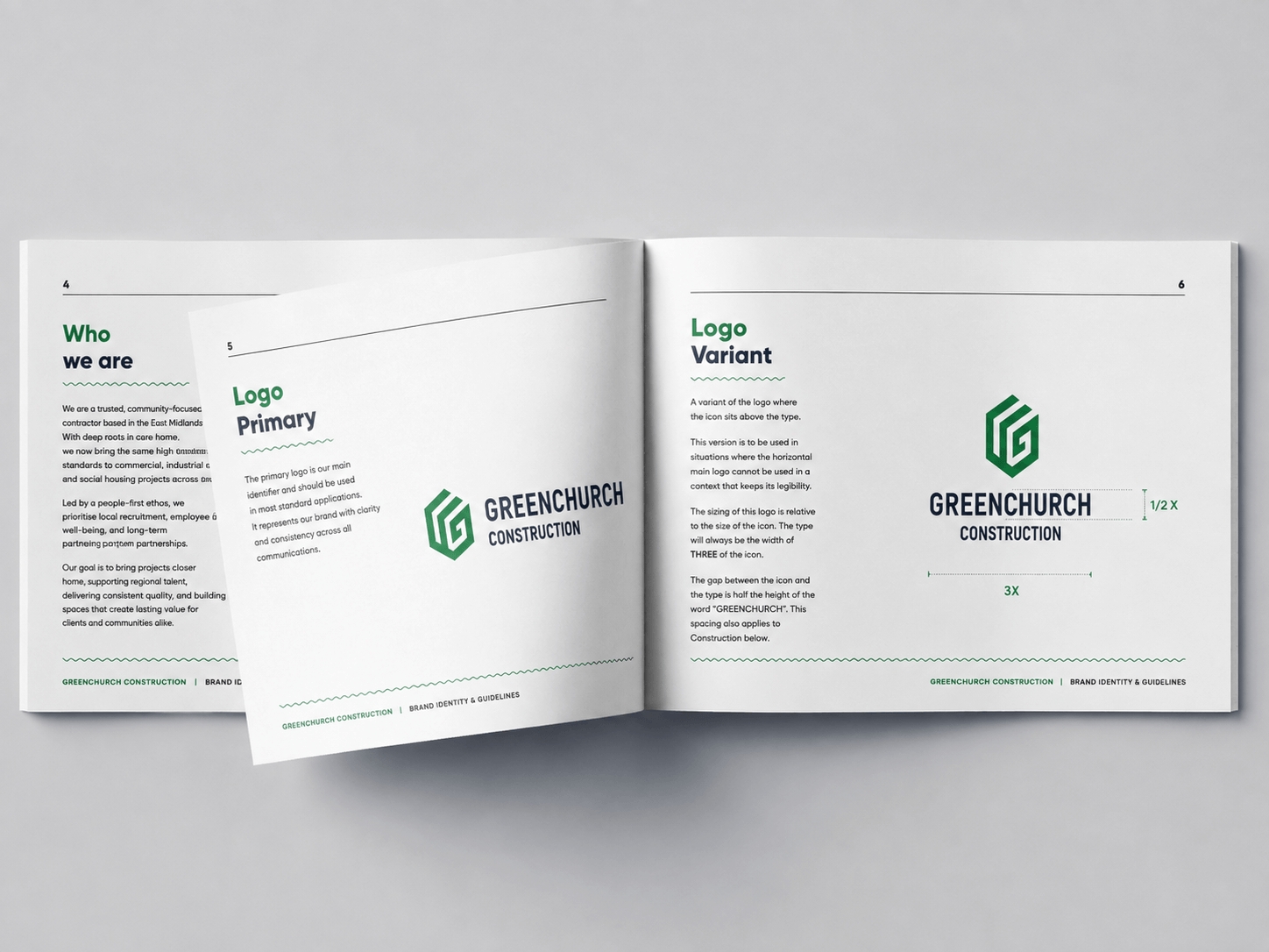Open brand guidelines booklet showing Greenchurch Construction logo and usage instructions