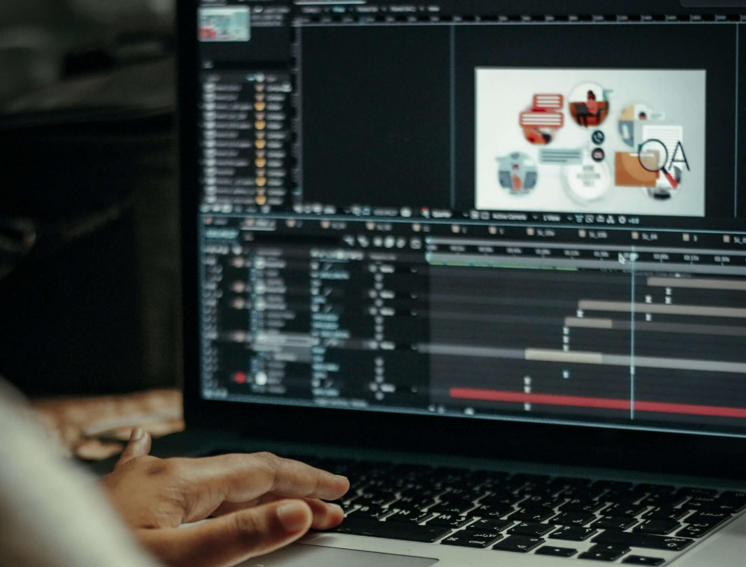 Close-up of hands working on animation software on a laptop