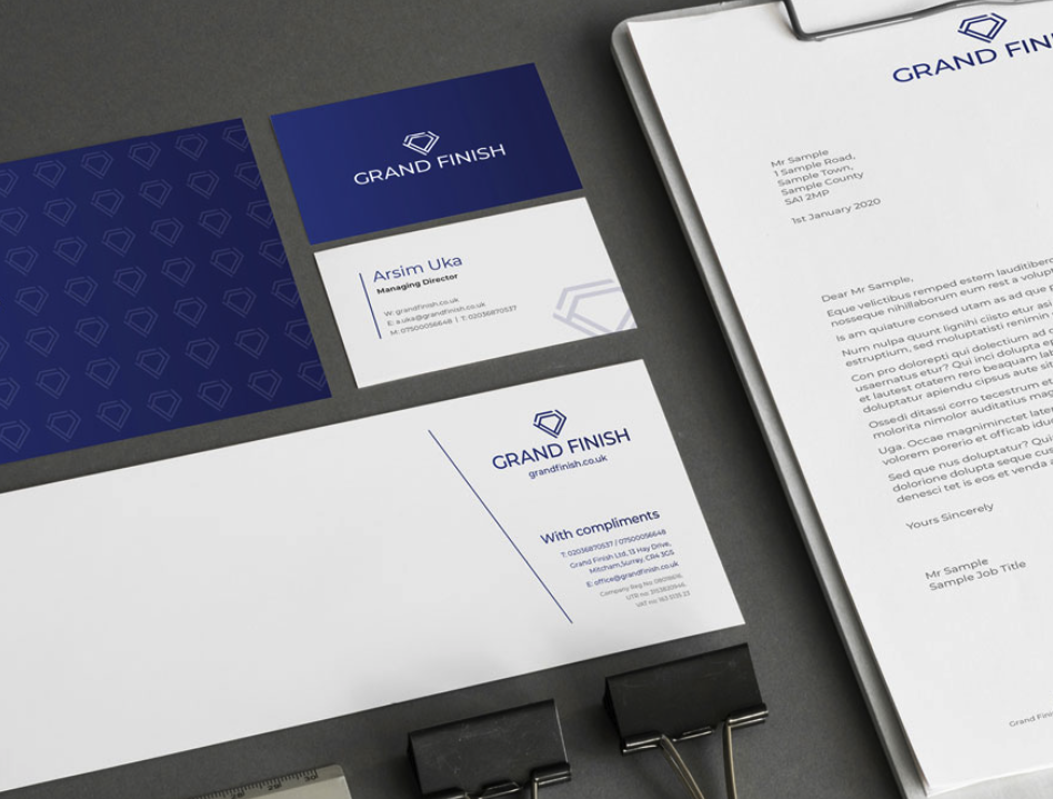 Grand Finish branded stationery including business cards, letterhead, and folder